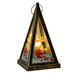 Vintage bronze pyramid Christmas lantern with warm LED light and Santa scene