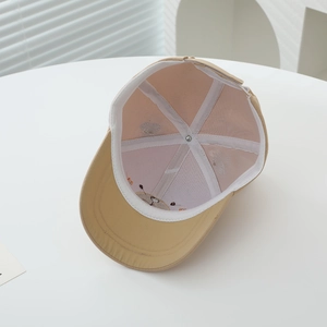 Detail of children's khaki animal cap showing interior stitching and sweatband