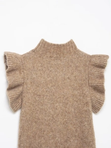Detail of a brown knit sweater featuring ruffled sleeves and a high neck collar