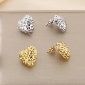 Sparkling heart earrings set in gold and silver finish with woven texture details