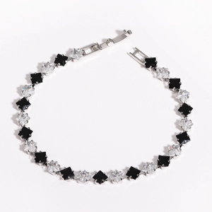 Detailed macro view of square black and white zircon stone spacer beads for DIY jewelry