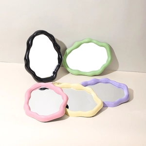 Collection of five colorful wavy cloud makeup mirrors in pastel plastic frames