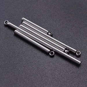 Macro detail of silver stainless steel minimalist bar pendants for DIY necklaces