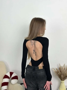 Sexy black ribbed bodysuit for women with long sleeves and backless cutout design
