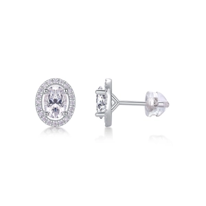 Detail of sterling silver oval-cut halo stud earrings with secure butterfly and silicone backs