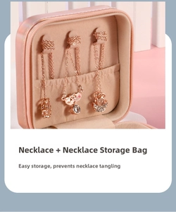 Pink iridescent PU leather jewelry box detail showing three necklace hooks and storage pouch
