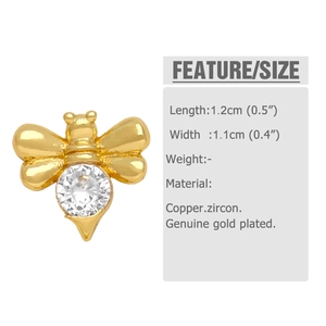 Macro shot of gold-plated bee earring with sparkling zircon and detailed size dimensions