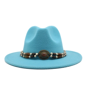 Detail of lake blue felt fedora hat featuring an ethnic beaded band with oval gemstone