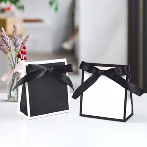 Elegant black and white paper gift bags with large silk ribbon bows in a 10-piece set