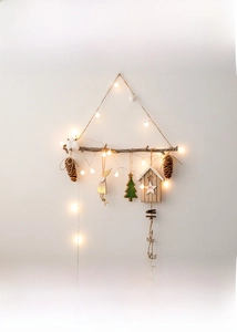 Hanging wooden branch Christmas tree with pine cones, cotton and warm LED light string