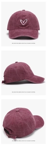 Close-up of heart embroidery on burgundy washed cotton baseball cap with adjustable strap