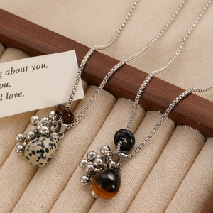 Grape-style faux pearl necklace with brown stone drop pendants on silver chain