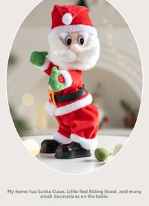Close-up of electric dancing Santa toy with red press button for musical interaction