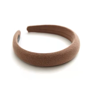 Brown padded sponge headband with textured twill fabric and non-slip inner lining
