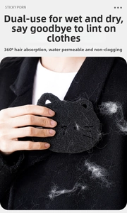Cat-shaped laundry sponge pet hair remover used on black wool coat for cleaning