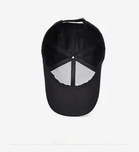 Detail view showing inner structure of a black baseball cap with breathable mesh and metal buckle