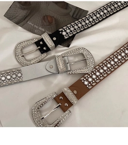 Detailed view of Y2K punk belts with sparkling rhinestones and metal rivets in three colors
