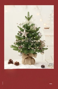 Close-up of a mini musical Christmas tree with LED lights and festive ornaments