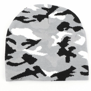 Detail of the camouflage knit beanie with grey, black, and white patterns for winter