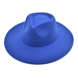 Close-up of a structured navy blue wool felt fedora hat with a classic teardrop crown