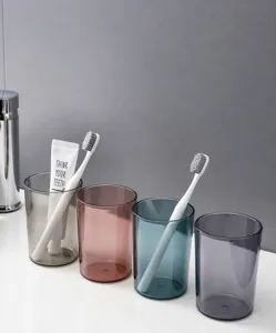 Macro shot of stylish thick transparent plastic tumblers in four modern gradient colors
