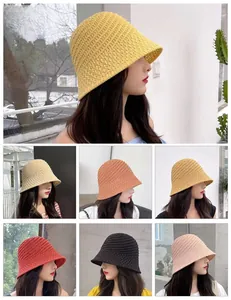 Detail of hollow crochet texture and variety of colors for this stylish summer straw bucket hat
