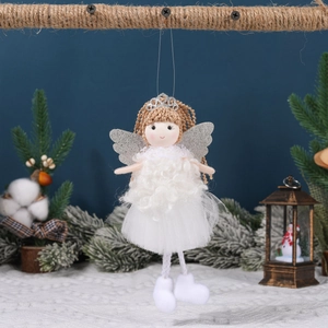Handmade Christmas angel plush hanging ornament with crown and wings on snowy branch