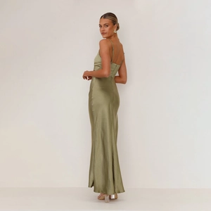 Detailed texture of olive green satin fabric on backless slit midi dress for women