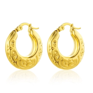 Golden round hoop earrings with elegant relief swirl pattern in minimalist French style