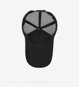 Detail view of the breathable mesh back and inner stitching of the black baseball cap