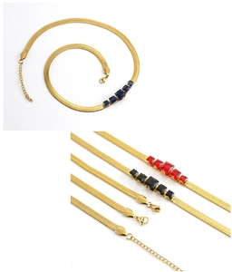 Close-up of 18k gold plated snake chain necklaces with colorful zircon stones