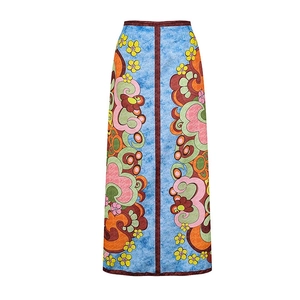 Retro floral print high-waisted maxi skirt with blue base and yellow swirl patterns