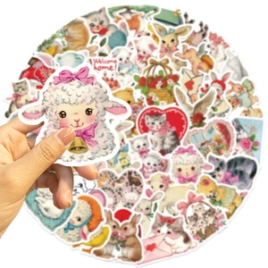 Close-up of vintage pink watercolor animal stickers for laptop and DIY scrapbooking decor