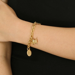 Detailed view of chunky 18K gold plated chain bracelet with cross and angel charms