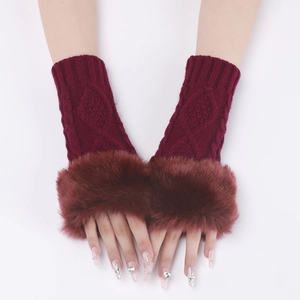 Detail of wine red knitted arm warmer with thick faux fur trim and fingerless design