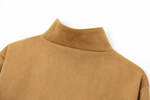 Detail of camel faux suede jacket featuring a stand collar and precision stitching
