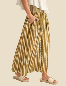 Close-up of yellow and white striped maxi skirt with high waist pleats and front buttons