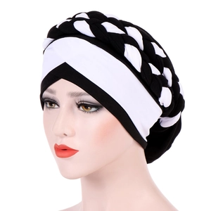 Detail of the black and white braided milk silk turban with crisscross woven design