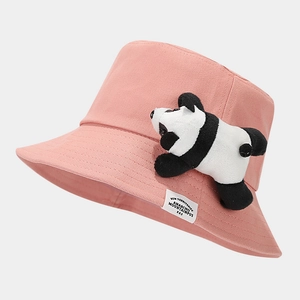 Detail of pink cotton bucket hat with a 3D panda plush and embroidered text label