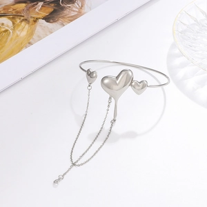 Lava heart silver arm cuff with elegant long chain fringe tassels on white background