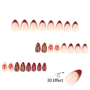 Amber tortoiseshell and burgundy almond press-on nails with 3D floral art designs