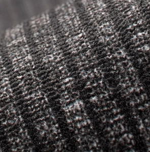 Macro view of dark grey kitchen mat fabric showing soft, non-slip knitted texture