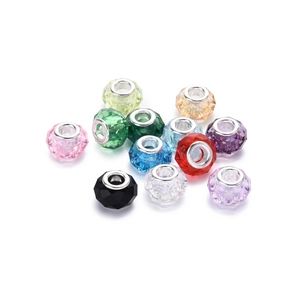Detailed view of faceted acrylic glass beads with silver metal cores for DIY jewelry