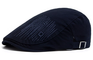 Detail of navy cotton newsboy cap with SXD embroidery and adjustable silver metal buckle
