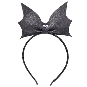 Detail of black glitter bat wing headband with white eyes for Halloween party hair accessory