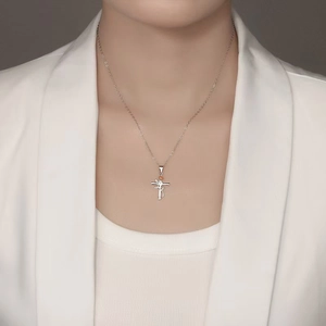 S925 silver necklace with cross and rose pendant with zircon, worn by woman on white