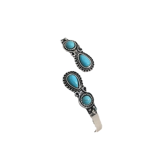 Vintage bohemian cuff bracelet with turquoise stones and silver-tone weave detail