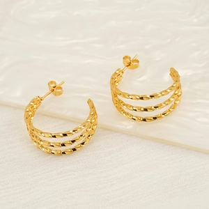 Golden multi-layered twisted hoop earrings for women with polished metal finish