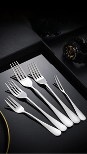 Detailed set of 5 stainless steel forks including dinner, dessert, and fruit salad sizes