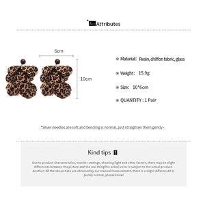 Macro shot showing size details of chiffon leopard print flower tassel earrings
